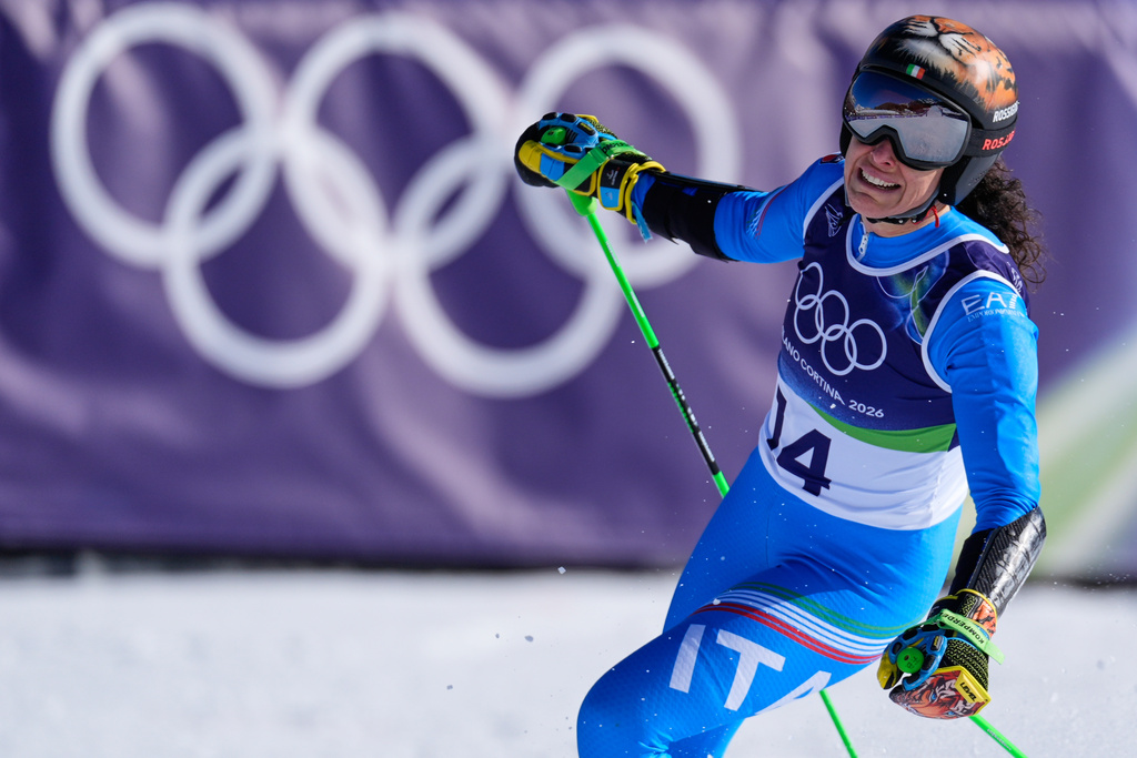 Italy's Federica Brignone celebrates winning an alpine ski, women's giant slalom race, at the 2026 Winter Olympics, in Cortina d'Ampezzo, Italy, Sunday, Feb. 15, 2026.(AP Photo/Robert F. Bukaty)
