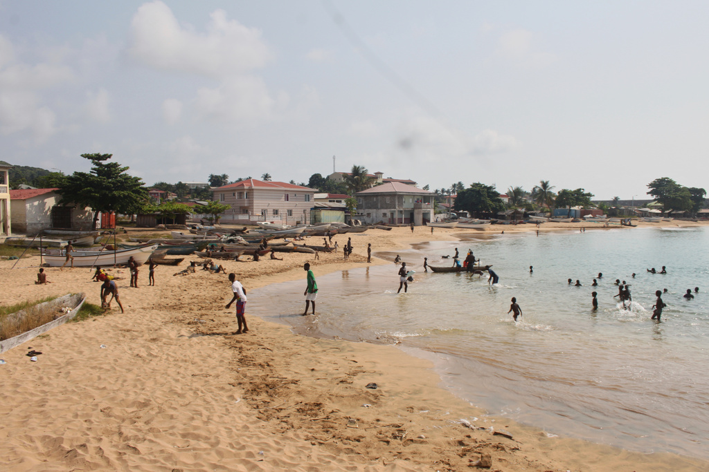 People swim and spend a day at the beach in Annobón Island, Equatorial Guinea, Sunday, June 12, 2022. (AP Photo)