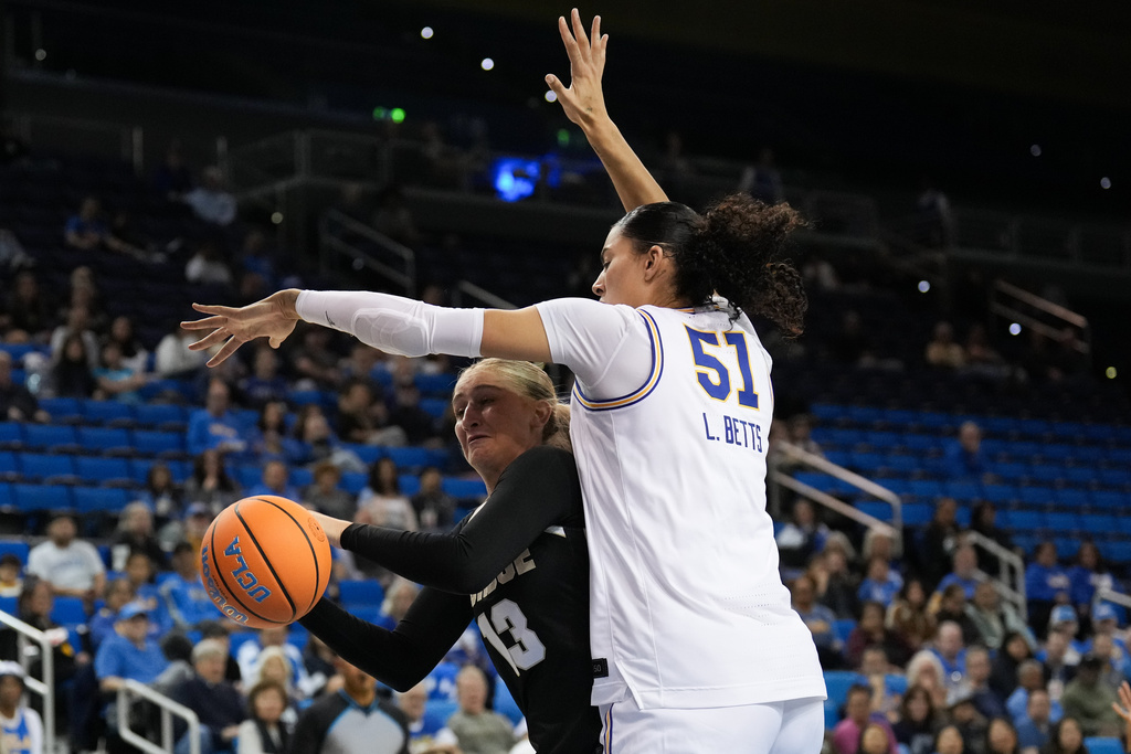 UCLA center Lauren Betts (51) defends Purdue forward Saige Stahl (13) during the first half of an NCAA women's college basketball game in Los Angeles, Wednesday, Jan. 21, 2026. (AP Photo/Jae C. Hong)