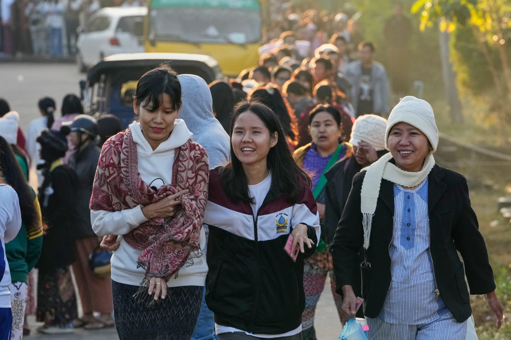 Voters leave after voting at a polling station in Naypyitaw, Myanmar, Sunday, Dec. 28, 2025. (AP Photo/Aung Shine Oo)