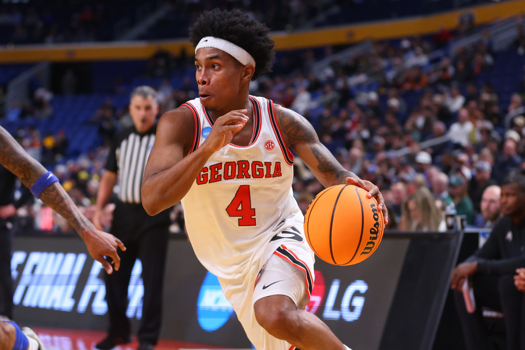 Georgia guard Marcus Millender (4) drives during the second half in the first round of the NCAA college basketball tournament against St. Louis, Thursday, March 19, 2026, in Buffalo, N.Y. (AP Photo/Jeffrey T. Barnes)