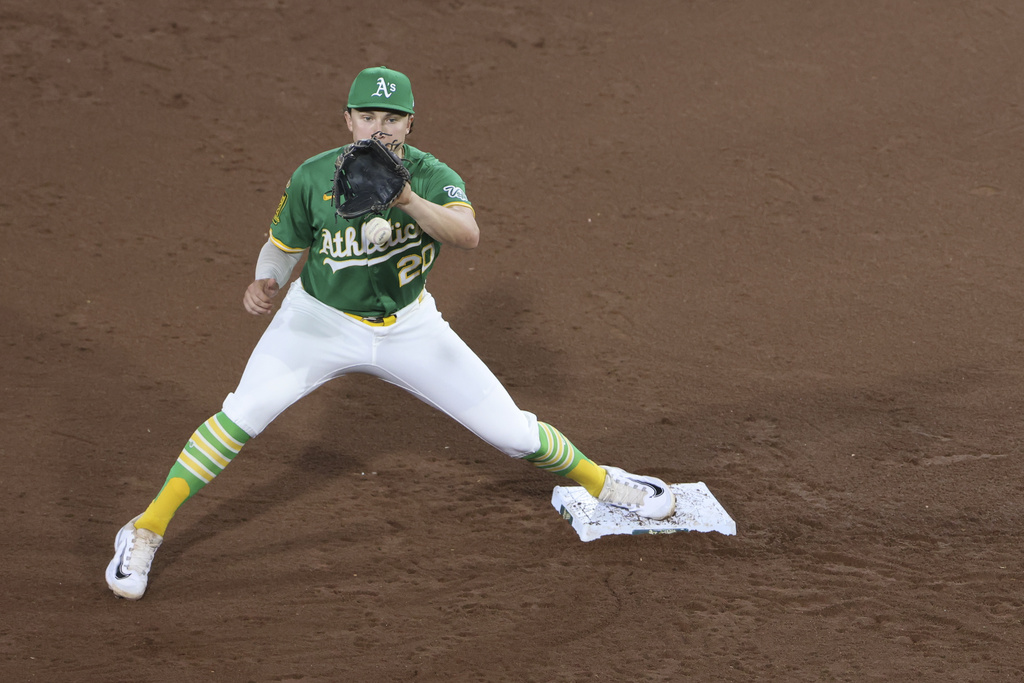 Athletics second baseman Zack Gelof catches a baseball for the force out during the sixth inning of a baseball game against the Detroit Tigers, Tuesday, Aug. 26, 2025, in West Sacramento, Calif. (AP Photo/Scott Marshall)