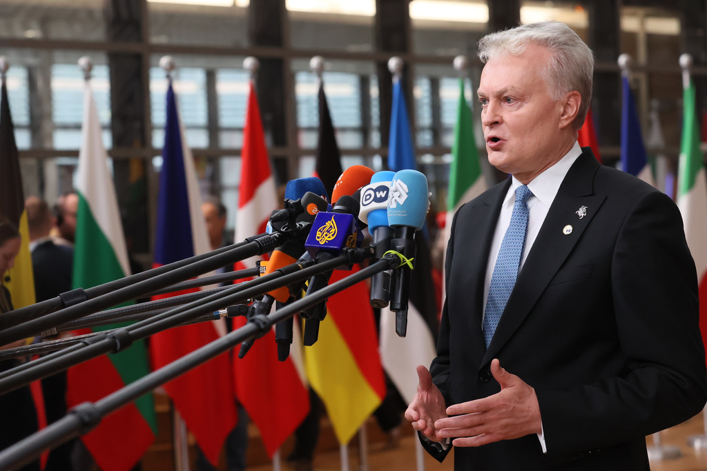 Lithuania's President Gitanas Nauseda speaks with the media as he arrives for an EU Summit at the European Council building in Brussels, Thursday, Oct. 23, 2025. (AP Photo/Francois Walschaerts)