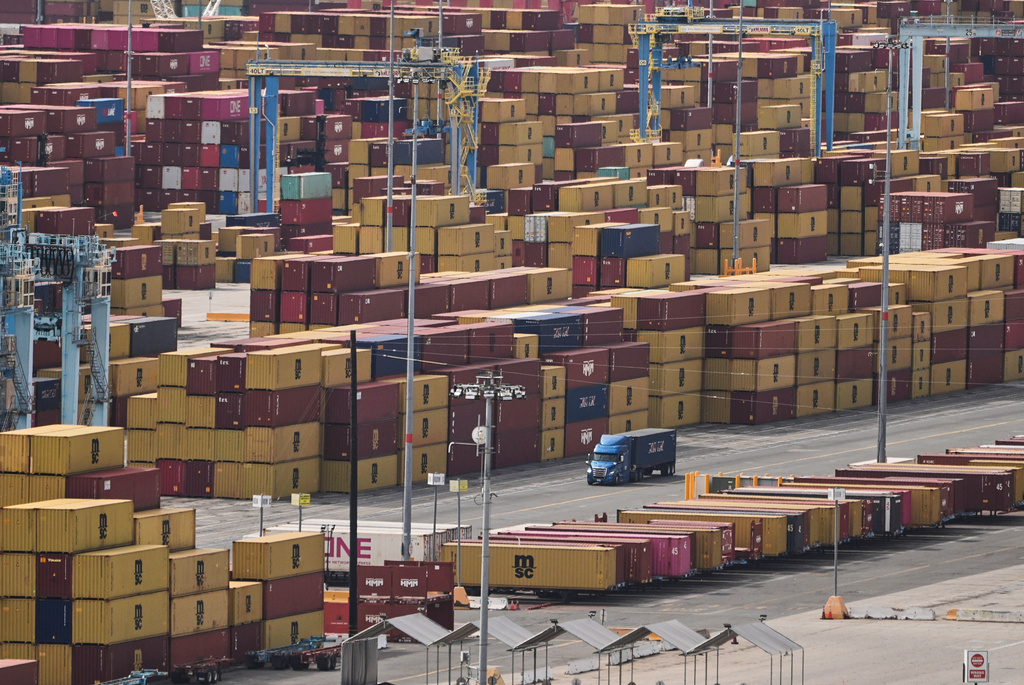 Containers are stacked at the Port of Long Beach Friday, Feb. 20, 2026, in Long Beach, Calif. (AP Photo/Damian Dovarganes)