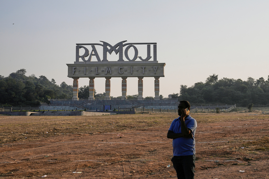A visitor speaks on his mobile phone at Ramoji Film City, in Hyderabad, India, Tuesday, Nov. 18, 2025. (AP Photo/Mahesh Kumar A.)