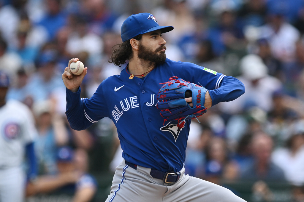 Toronto Blue Jays starter Dylan Cease delivers a pitch during the first inning of a baseball game against the Chicago Cubs in Chicago, Thursday, Aug. 6, 2026. (AP Photo/Paul Beaty)