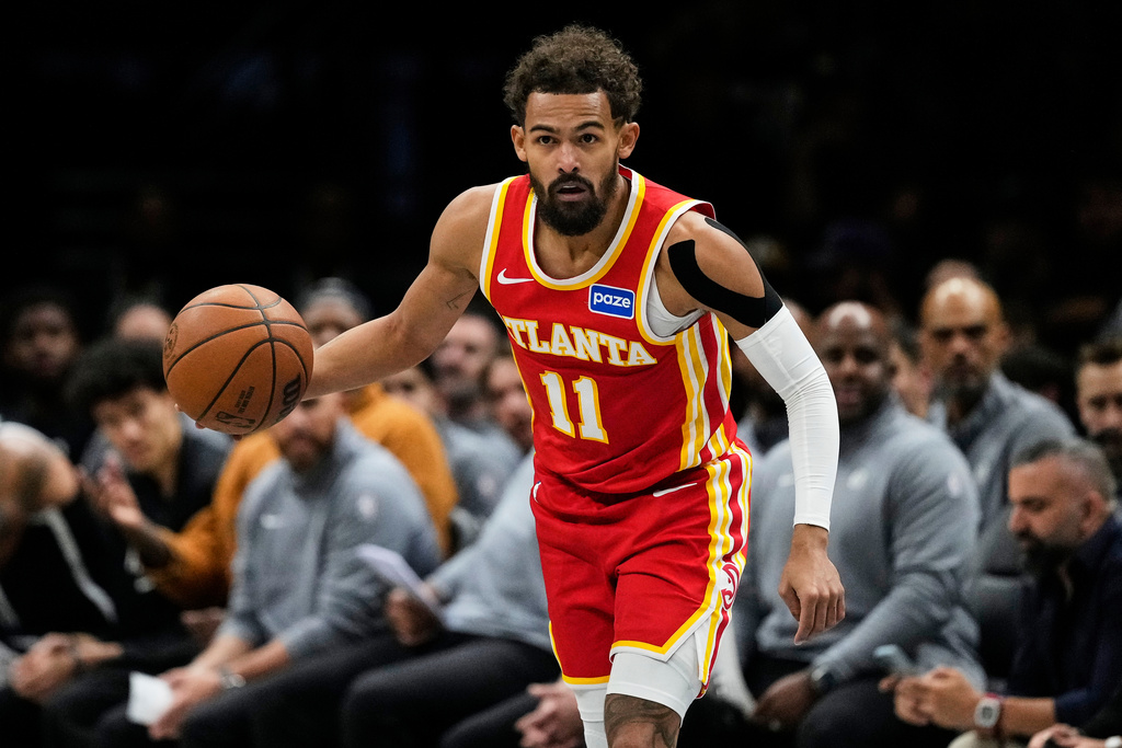 Atlanta Hawks' Trae Young (11) looks to pass during the first half of an NBA basketball game against the Brooklyn Nets Wednesday, Oct. 29, 2025, at Barclays Center in New York. (AP Photo/Frank Franklin II)