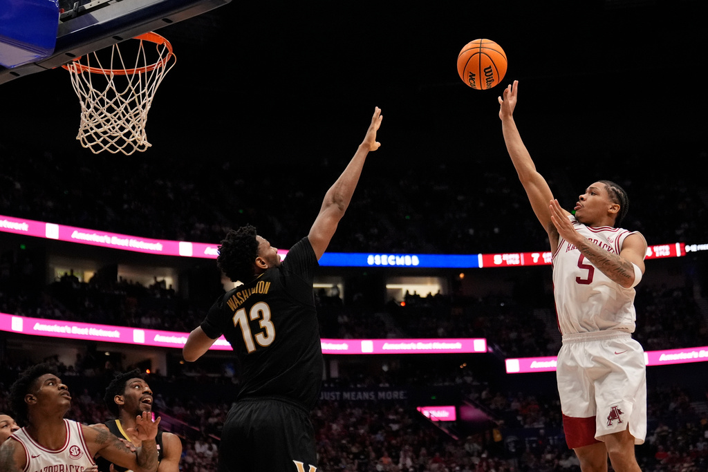 Arkansas guard Darius Acuff Jr. (5) shoots the ball over Vanderbilt forward Jalen Washington (13) during the second half of an NCAA college basketball game in the final of the Southeastern Conference tournament Sunday, March 15, 2026, in Nashville, Tenn. (AP Photo/George Walker IV)