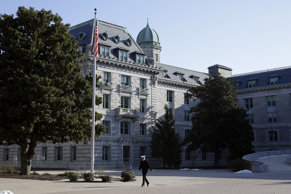 FILE - A midshipman walks outside of Bancroft Hall, the main dormitory on the U.S. Naval Academy campus, in Annapolis, Md., Jan. 9, 2014. (AP Photo/Patrick Semansky, File)