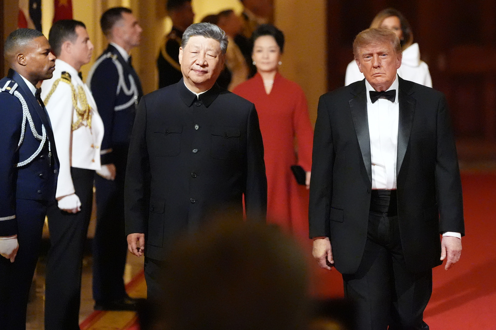 President Donald Trump arrives with China's President Xi Jinping and first lady Melania Trump and Peng Liyuan during a State Dinner for China's President Xi Jinping in the East Room of the White House, Thursday, Sept. 24, 2026, in Washington. (AP Photo/Alex Brandon)