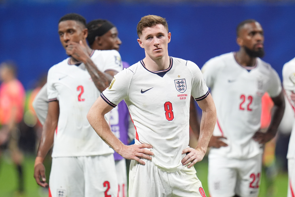 England's Ezri Konsa (2), England's Elliot Anderson (8) and England's Ivan Toney (22) are dejected at the end of the World Cup semifinal soccer match between England and Argentina in Atlanta, Wednesday, July 15, 2026. (AP Photo/Jeff Roberson)