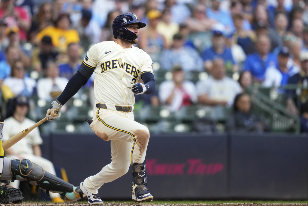 Milwaukee Brewers' Brice Turang hits a single during the third inning of a baseball game against the Arizona Diamondbacks, Thursday, Aug. 28, 2025, in Milwaukee. (AP Photo/Kayla Wolf)