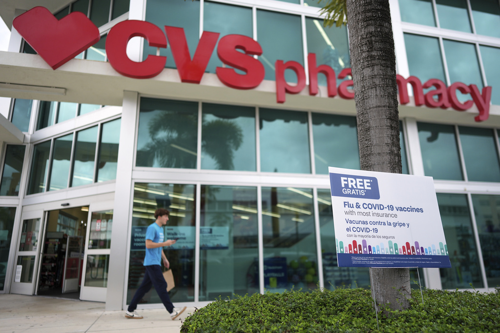 Vaccines are advertised outside a pharmacy in Miami, Thursday, Sept. 4, 2025. (AP Photo/Rebecca Blackwell)