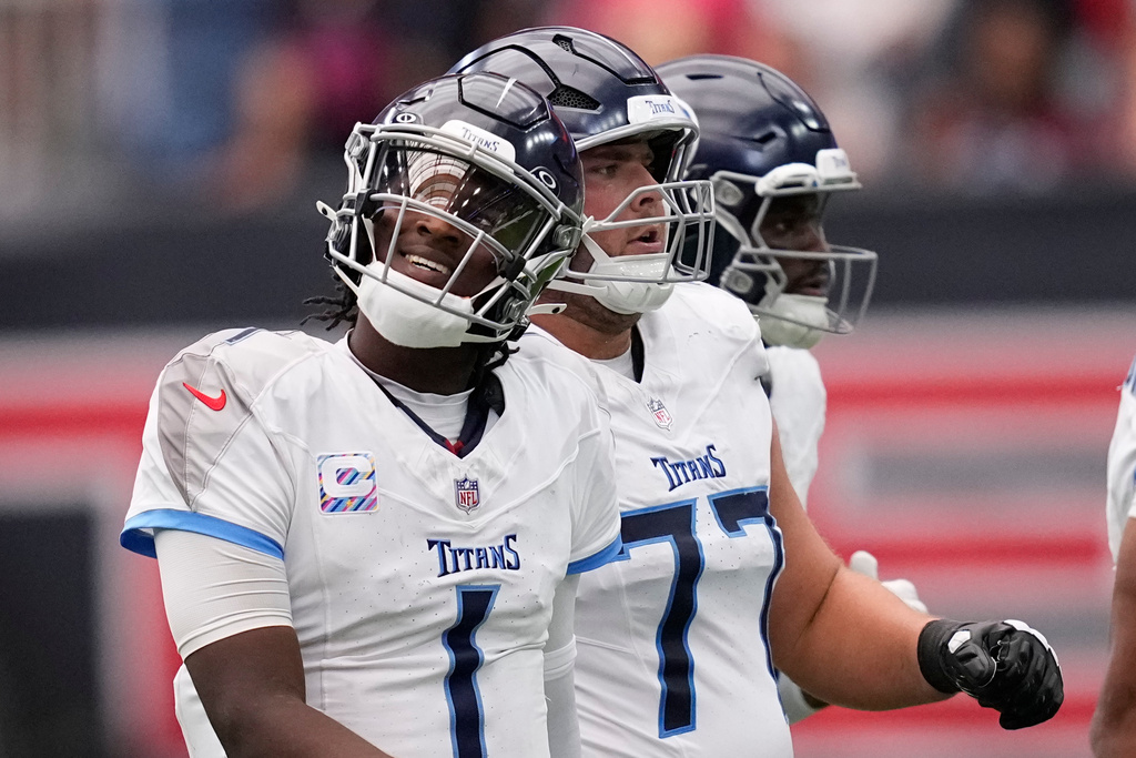 Tennessee Titans quarterback Cam Ward (1) reacts as he walks to the sideline after throwing an interception during the second half of an NFL football game against the Houston Texans, Sunday, Sept. 28, 2025, in Houston. (AP Photo/David J. Phillip)