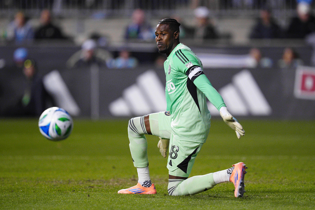 Philadelphia Union goalkeeper Andre Blake watches the ball in the first half of Game 1 in the first round of MLS soccer's Eastern Conference playoffs against the Chicago Fire, Sunday, Oct. 26, 2025, in Chester, Pa. (AP Photo/Derik Hamilton)