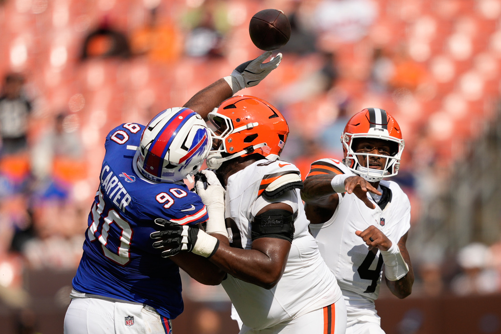 Buffalo Bills defensive lineman DeWayne Carter (90) tips a pass from Cleveland Browns quarterback Deshaun Watson (4) during the second half of an NFL preseason football game, Saturday, Aug. 22, 2026, in Cleveland. (AP Photo/Carolyn Kaster)