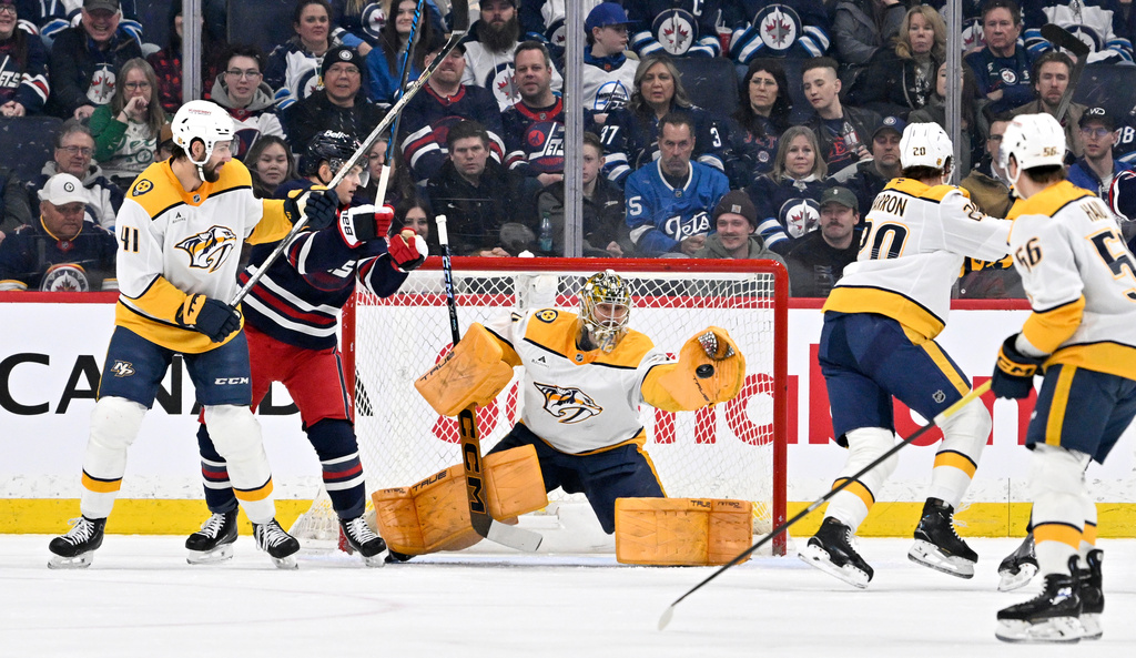 Nashville Predators goaltender Juuse Saros (74) makes a save on a Winnipeg Jets shot during the first period of their NHL hockey game in Winnipeg, Tuesday March 17, 2026. THE CANADIAN PRESS/Fred Greenslade/The Canadian Press via AP)