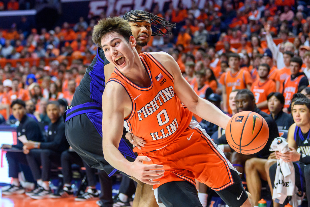 Illinois' forward David Mirkovic (0) drives to the basket during the first half of an NCAA college basketball game against Washington, Thursday, Jan. 29, 2026, in Champaign, Ill. (AP Photo/Craig Pessman)