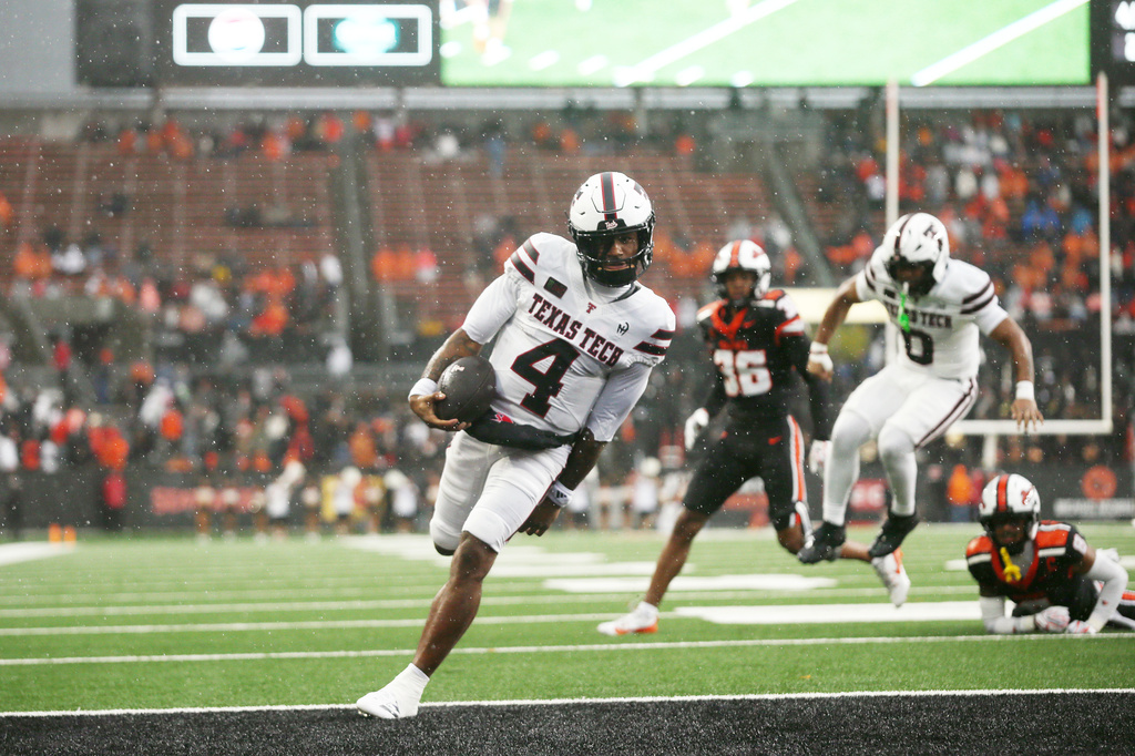 Texas Tech quarterback Tommy Castellanos (4) runs into the end zone for a touchdown during the first half of an NCAA college football game against Oregon State, Saturday, Sept. 12, 2026, in Corvallis, Ore. (AP Photo/Lydia Ely)