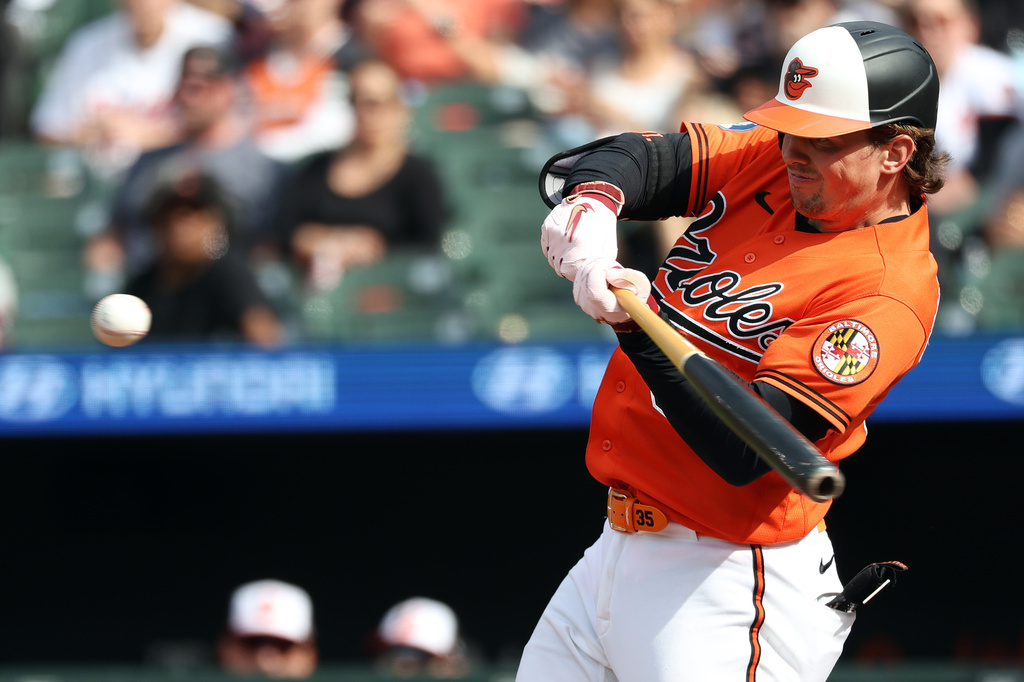 Baltimore Orioles' Adley Rutschman hits a double during the first inning of a baseball game against the Athletics, Saturday, May 9, 2026, in Baltimore. (AP Photo/Daniel Kucin Jr.)
