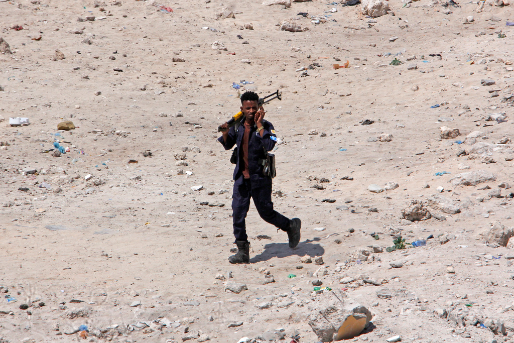 Somali army personnel patrol near the scene of the aftermath of an hours-long militant attack in Mogadishu, Somalia, on Sunday, Oct. 5, 2025. (AP Photo/Farah Abdi Warsameh)