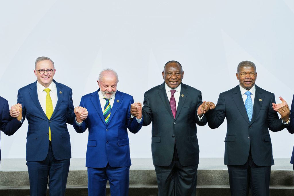 Australia's Prime Minister Anthony Albanese, Brazil's President Luiz Inacio Lula da Silva, South Africa's President Cyril Ramaphosa and. President of Angola and Chairperson of the African Union Joao Lourenco gesture as leaders gather for a group photo at the G20 leaders' summit in Johannesburg, South Africa, Saturday, Nov. 22, 2025. (AP Photo/Misper Apawu, Pool)