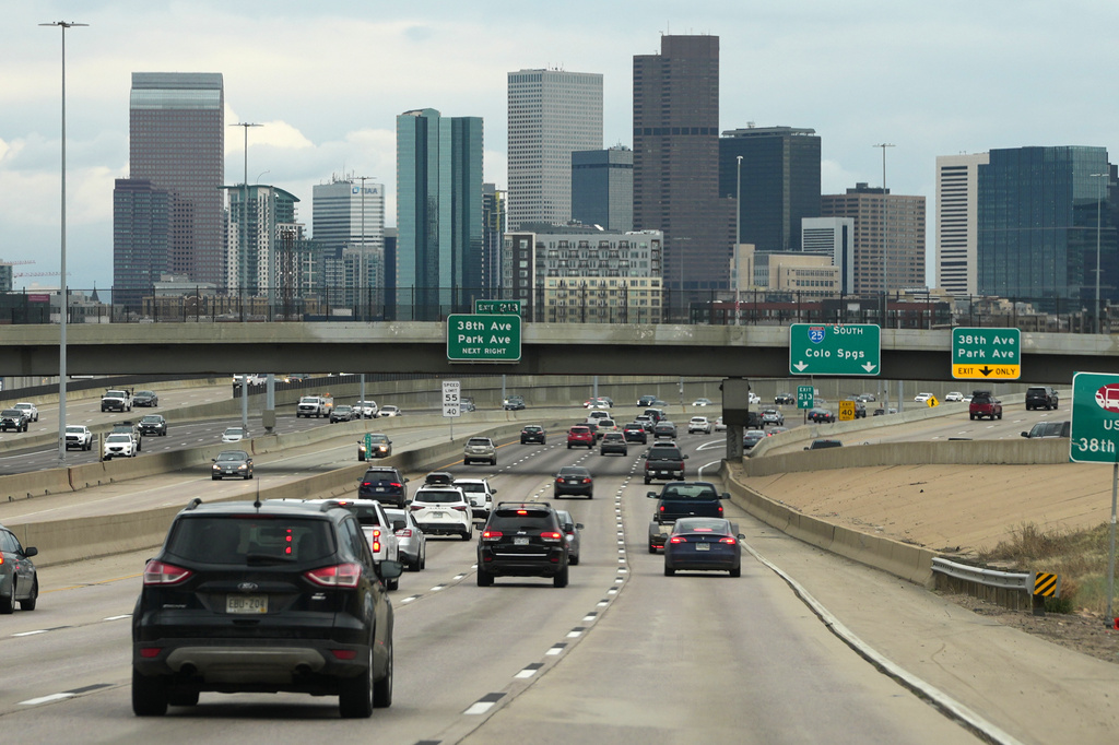FILE - Motorists drive on southbound Interstate 25 with the city skyline in the background April 30, 2026, in Denver. (AP Photo/David Zalubowski, File)