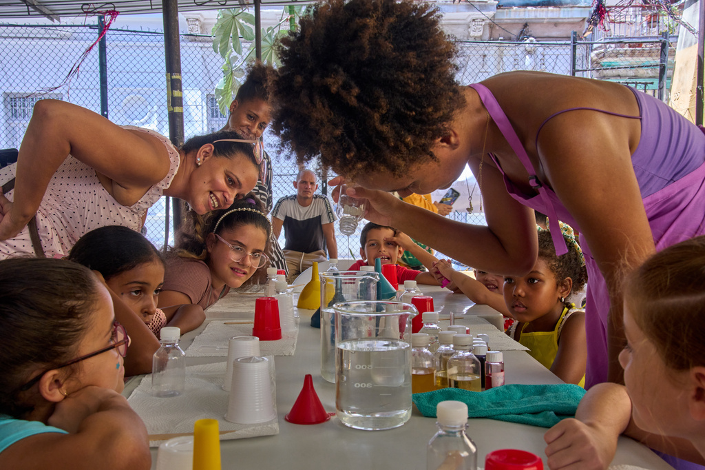 Children attend a workshop to make gift bags and perfume in Havana, Cuba, Friday, Aug. 28, 2026. (AP Photo/Ramon Espinosa)