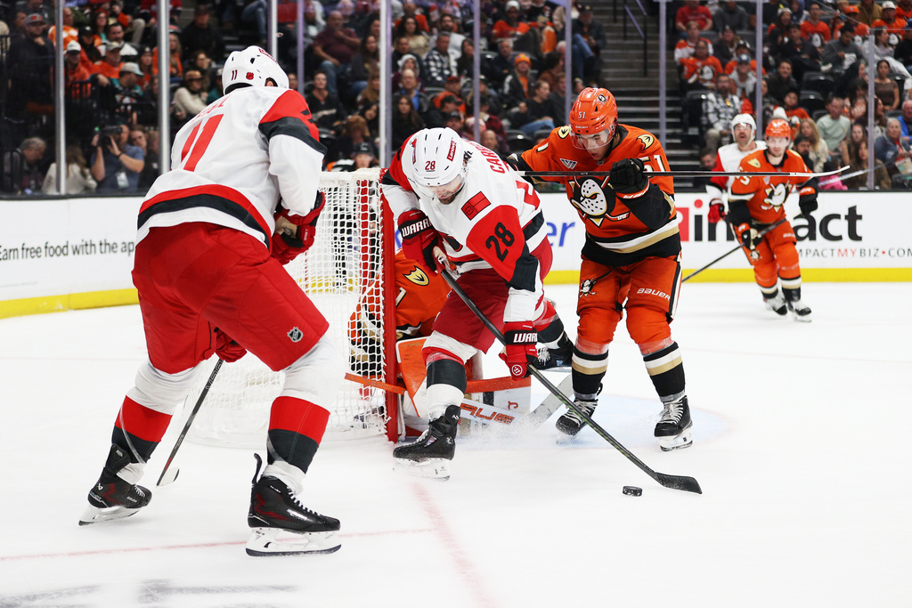 Carolina Hurricanes left wing William Carrier (28) attempts to score against Anaheim Ducks goaltender Lukas Dostal (1) during the second period of an NHL hockey game Thursday, Oct. 16, 2025, in Anaheim, Calif. (AP Photo/Ethan Swope)