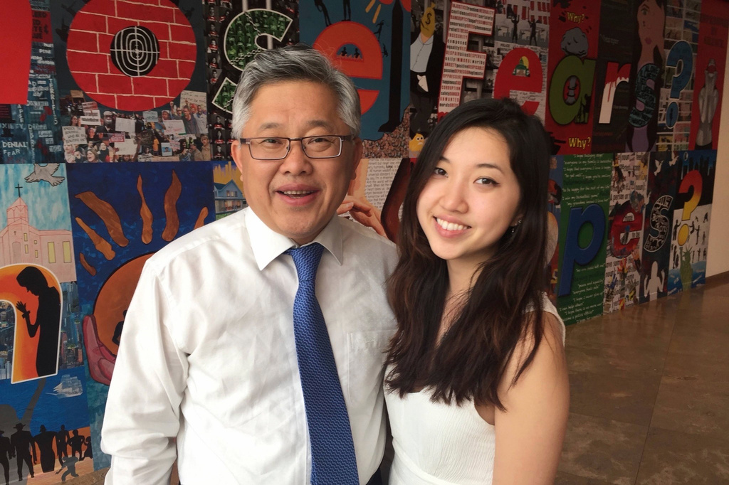 In this photo taken in 2015 and released by Grace Jin Drezel, pastor Ezra Jin Mingri and daughter Grace Jin Drexel pose for a photo in Los Angeles. (Grace Jin Drexel via AP)
