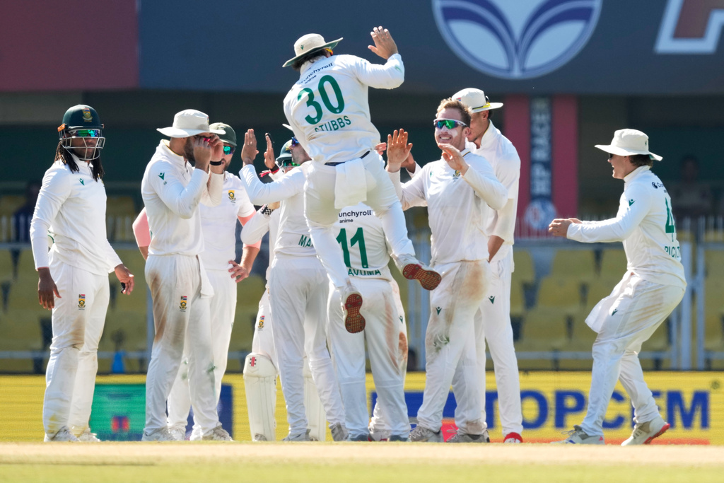 South Africa's players celebrate the dismissal of India's Washington Sundar on the fifth day of the second cricket test match between India and South Africa in Guwahati, India, Saturday, Nov. 22, 2025. (AP Photo/Anupam Nath)