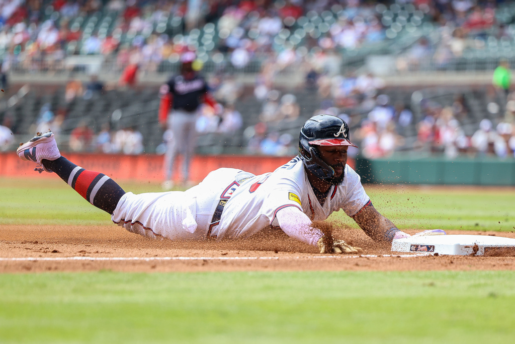 Atlanta Braves' Michael Harris II steals third base in the fifth inning of a baseball game against the Washington Nationals, Wednesday, Sept. 24, 2025, in Atlanta. (AP Photo/Colin Hubbard)