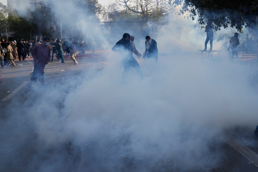 Police fire tear gas shell to disperse Shiite Muslims protesters near the U.S Consulate during a rally condemning the killing of Iranian Supreme Leader Ayatollah Ali Khamenei, in Lahore, Pakistan, Sunday, March 1, 2026. (AP Photo/K.M. Chaudary)