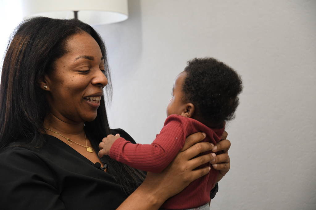 Shanille Bowens, a doula, smiles at Isaiah Stewart during an appointment on Feb. 28, 2026, in Memphis, Tenn. (AP Photo/Kristin M. Hall)