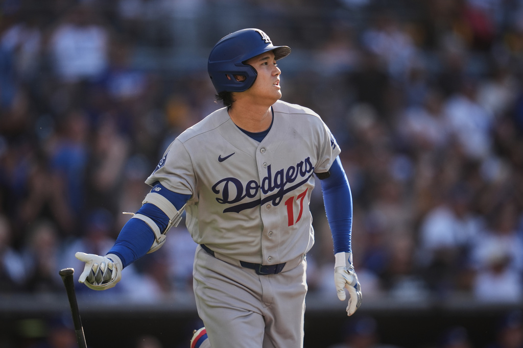 Los Angeles Dodgers' Shohei Ohtani watches his home run during the first inning of a baseball game against the San Diego Padres Wednesday, May 20, 2026, in San Diego. (AP Photo/Gregory Bull)
