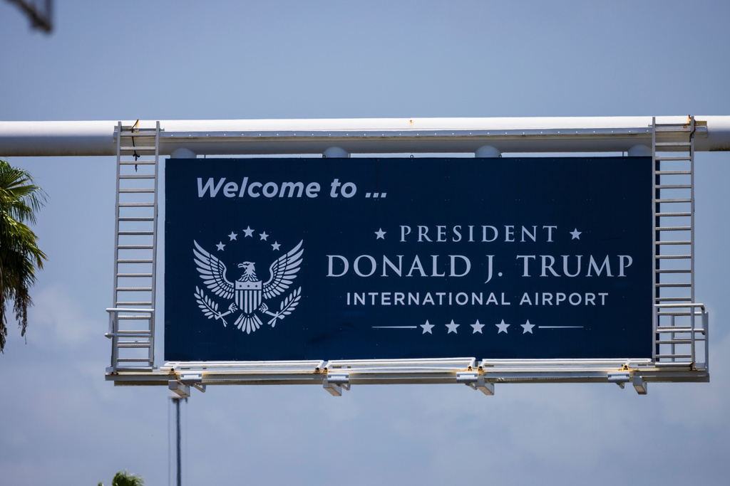 A sign displaying the name of the rebranded Donald J. Trump International Airport in West Palm Beach, Fla., is seen Thursday, July 9, 2026. (AP Photo/Saul Martinez)
