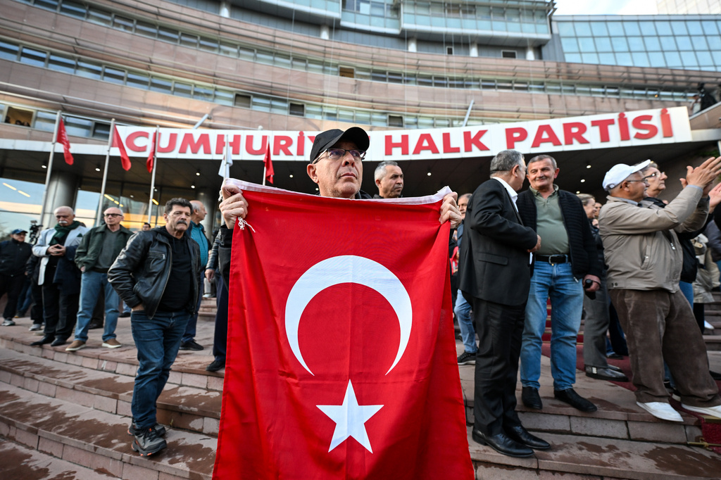 Supporters of Turkey's main opposition Republican People's Party, or CHP, gather outside the party's headquarters in Ankara, Friday, May 22, 2026. (Gunsu Ozmen/DIA Photo via AP)