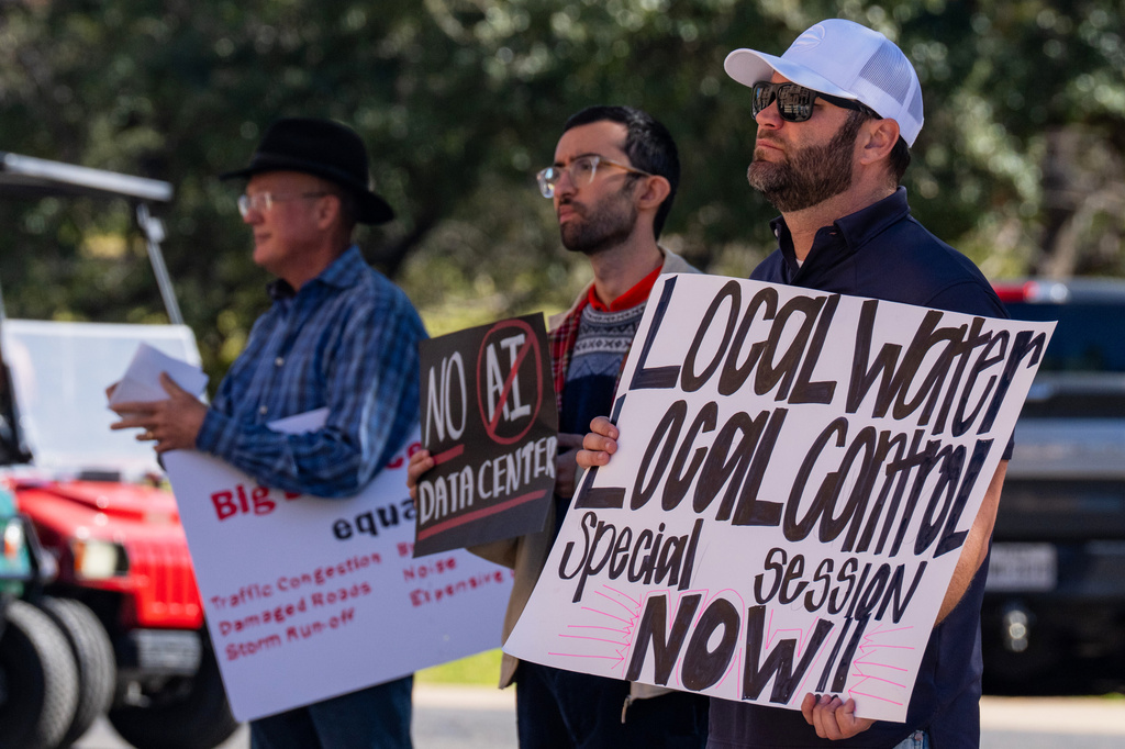 FILE - Advocacy groups and community members protest laws surrounding data centers while outside the Texas Capitol, in Austin, Texas, Feb. 23, 2026. (Mikala Compton/Austin American-Statesman via AP, File)