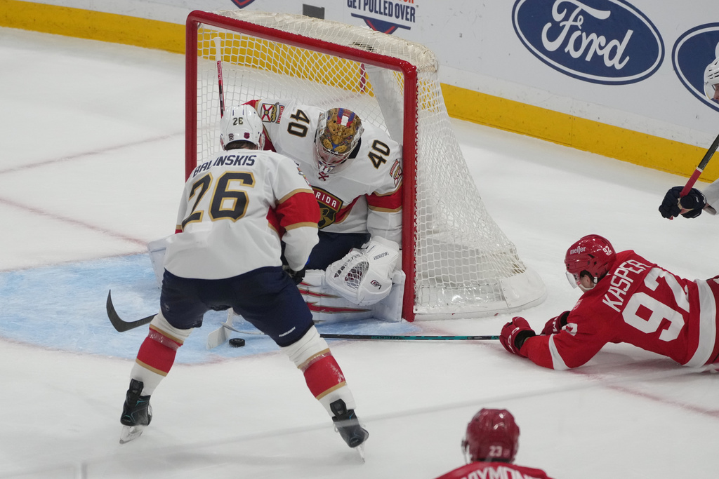 Florida Panthers goaltender Daniil Tarasov (40) stops a shot on goal by Detroit Red Wings center Marco Kasper (92) during the third period of an NHL hockey game, Tuesday, March 10, 2026, in Sunrise, Fla. (AP Photo/Marta Lavandier)