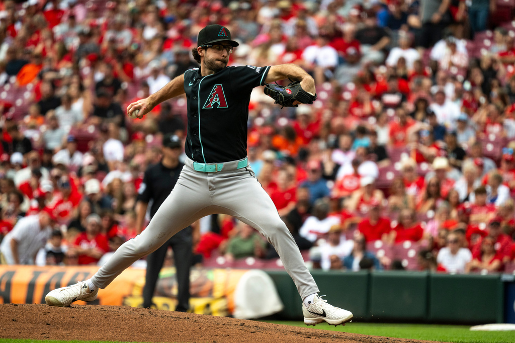 Arizona Diamondbacks pitcher Zac Gallen delivers in the first inning of a baseball game against the Cincinnati Reds, Sunday, June 14, 2026, in Cincinnati. (AP Photo/Michael Swensen)