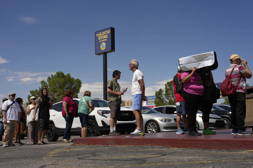 People wait in line to buy lottery tickets at the Lotto Store just inside the California border, Wednesday, Sept. 3, 2025, near Primm, Nev. (AP Photo/John Locher)