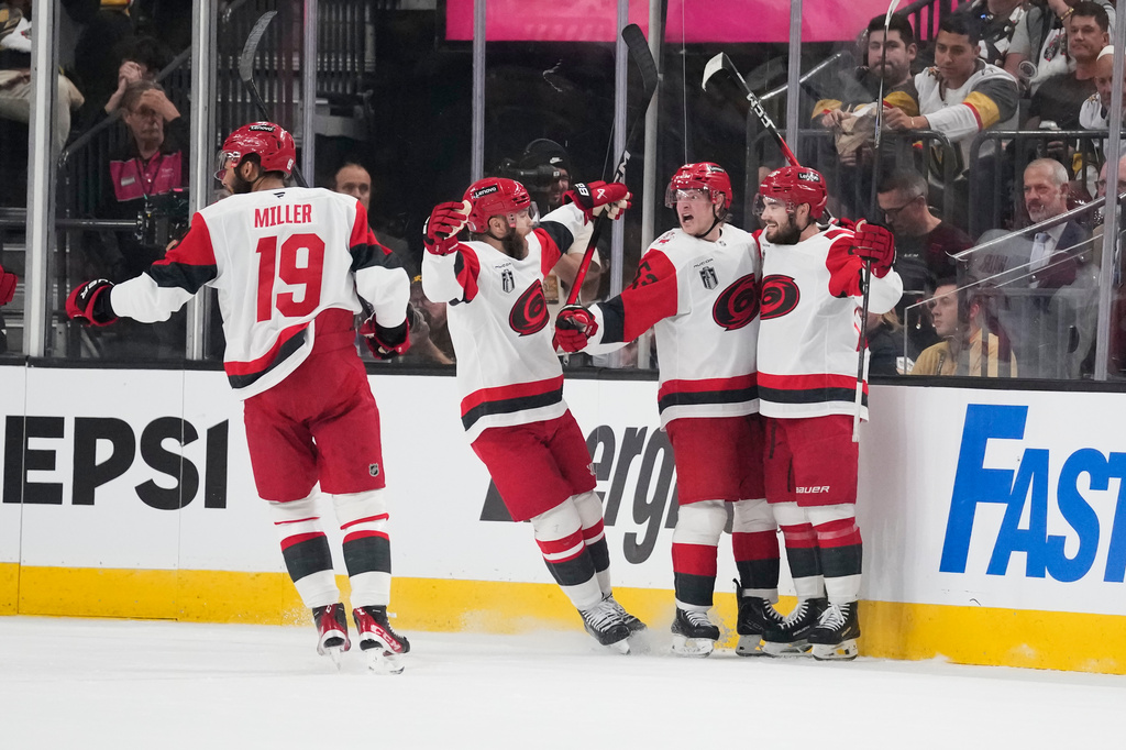 Carolina Hurricanes right wing Jackson Blake, second from right, celebrates his goal with teammates during the second period in Game 6 of the NHL hockey Stanley Cup Final series against the Vegas Golden Knights, Sunday, June 14, 2026, in Las Vegas. (AP Photo/John Locher)