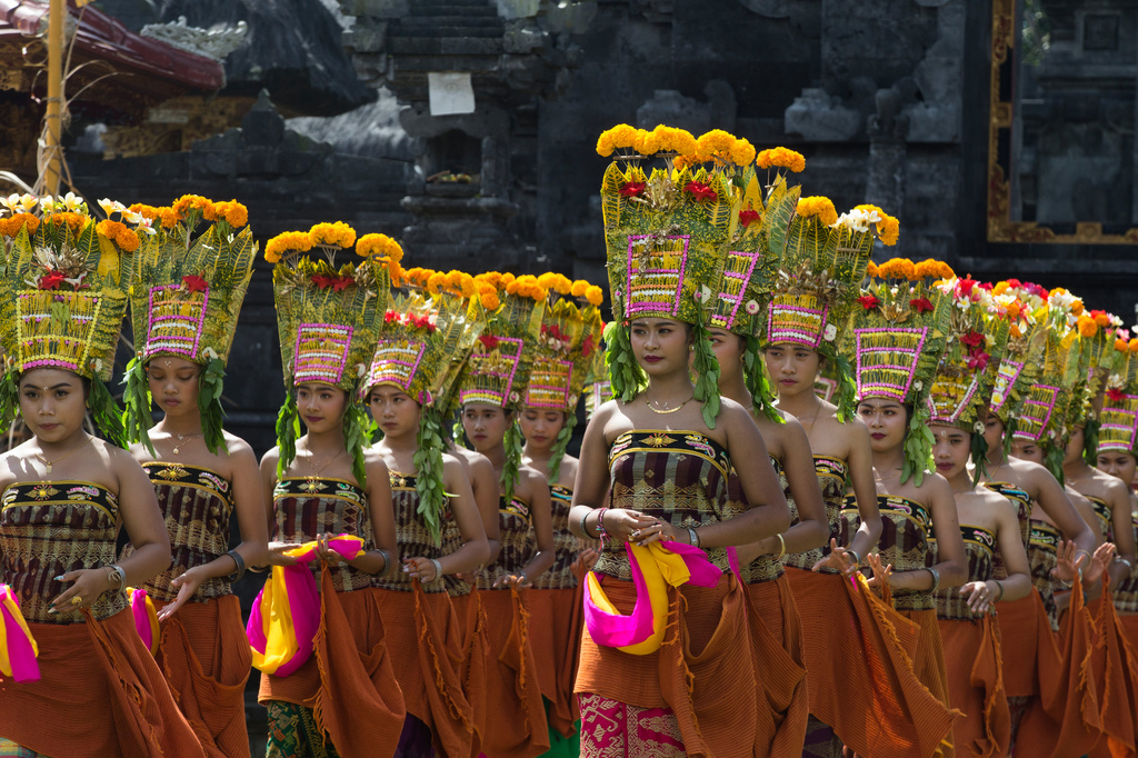 Dancers perform the sacred Rejang dance during Kuningan holiday, which marks the end of the 10-day Galungan festival celebrating the victory of good over evil, in Karangasem, Bali, Indonesia, Saturday, June 27, 2026. (AP Photo/Firdia Lisnawati)