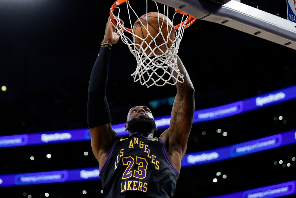 Los Angeles Lakers forward LeBron James (23) dunks the ball during the second half of an NBA basketball game against the Orlando Magic, Tuesday, Feb. 24, 2026, in Los Angeles. (AP Photo/Caroline Brehman)