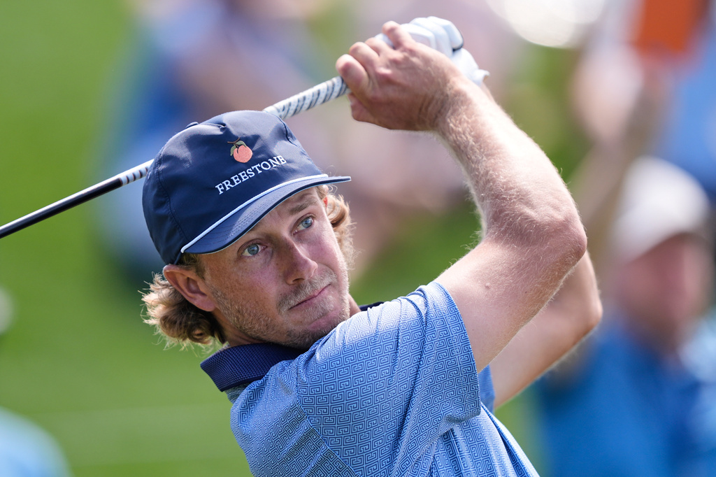 FILE - Austin Smotherman hits off the 18th tee during the second round of The Players Championship golf tournament Friday, March 13, 2026, in Ponte Vedra Beach, Fla. (AP Photo/Gerald Herbert, file)