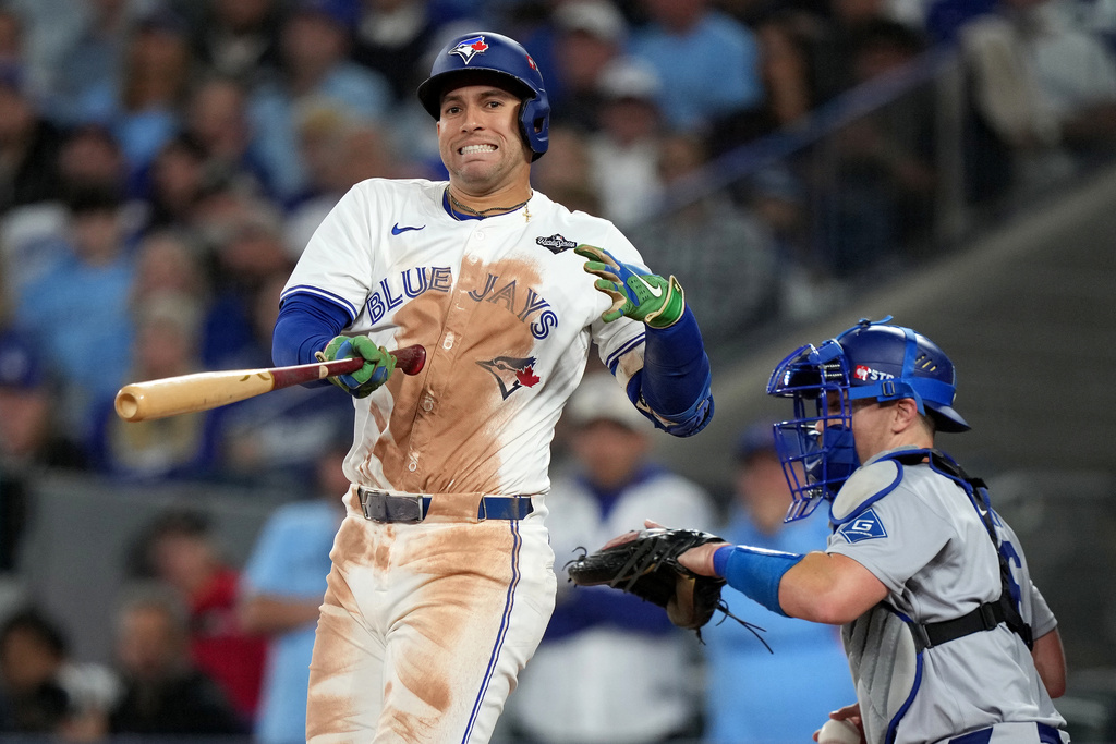 Toronto Blue Jays' George Springer (4) reacts after striking out against the Los Angeles Dodgers during the eighth inning in Game 2 of baseball's World Series, Saturday, Oct. 25, 2025, in Toronto. (Nathan Denette/The Canadian Press via AP)