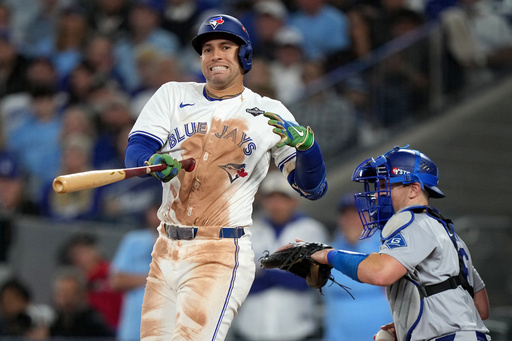 Toronto Blue Jays' George Springer (4) reacts after striking out against the Los Angeles Dodgers during the eighth inning in Game 2 of baseball's World Series, Saturday, Oct. 25, 2025, in Toronto. (Nathan Denette/The Canadian Press via AP) Toronto Blue Jays' George Springer (4) reacts after striking out against the Los Angeles Dodgers during the eighth inning in Game 2 of baseball's World Series, Saturday, Oct. 25, 2025, in Toronto. (Nathan Denette/The Canadian Press via AP)