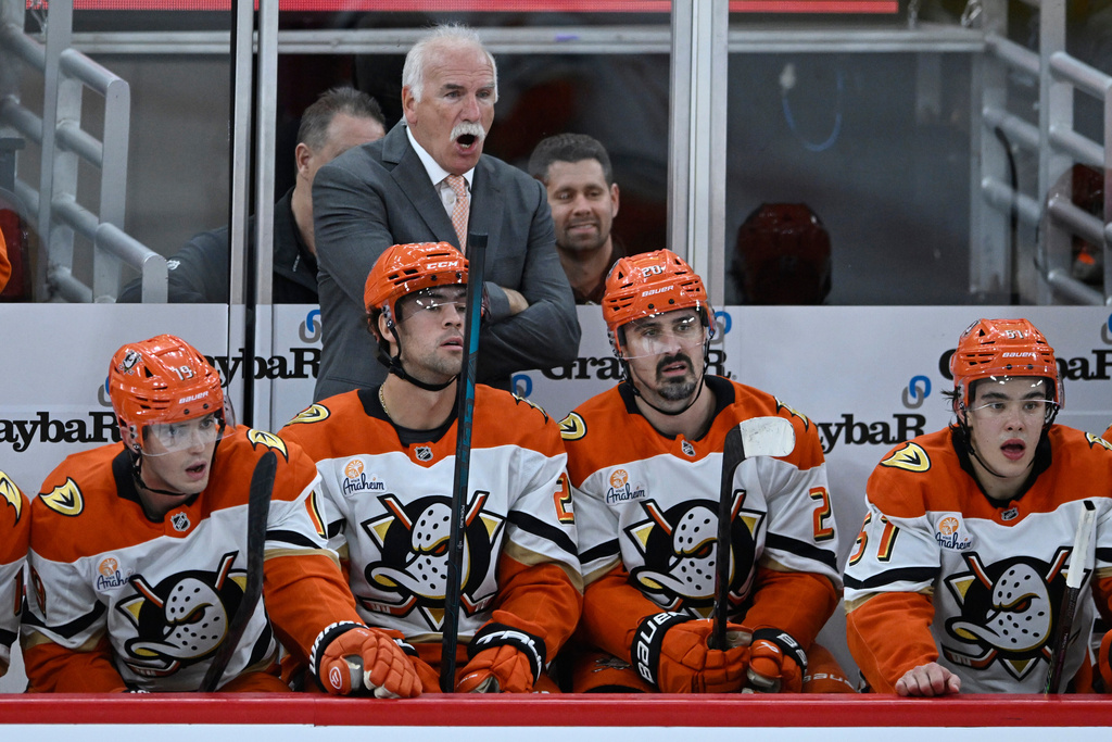Anaheim Ducks head coach Joel Quenneville, center top, yells to his players during the second period of an NHL hockey game against the Chicago Blackhawks, Sunday, Oct. 19, 2025, in Chicago. (AP Photo/Paul Beaty)