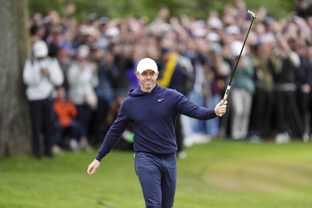 Rory McIlroy of Northern Ireland acknowledges the spectators on the 18th during day four of the 2025 BMW PGA Championship at Wentworth Golf Club in Virginia Water, Surrey, England, Sunday Sept. 14, 2025. (Adam Davy/PA via AP)