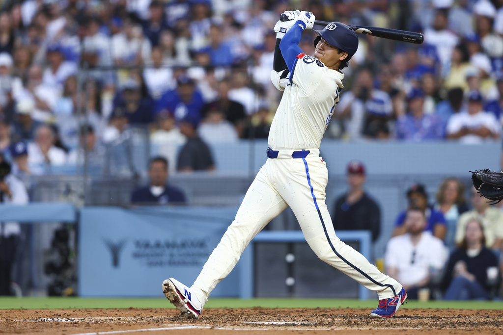 Los Angeles Dodgers' Shohei Ohtani follows through on a home run during the fifth inning of a baseball game against the Toronto Blue Jays, Saturday, Aug. 9, 2025, in Los Angeles. (AP Photo/Jessie Alcheh)